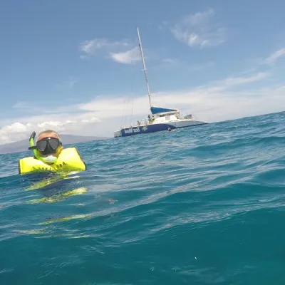 child snorkeling in water