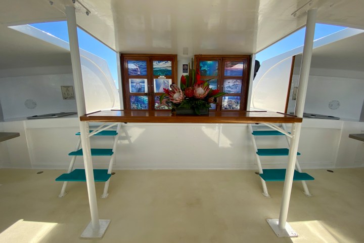 a room filled with furniture and a large window