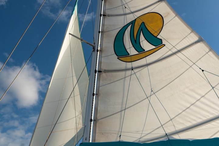 a sign hanging from a wire