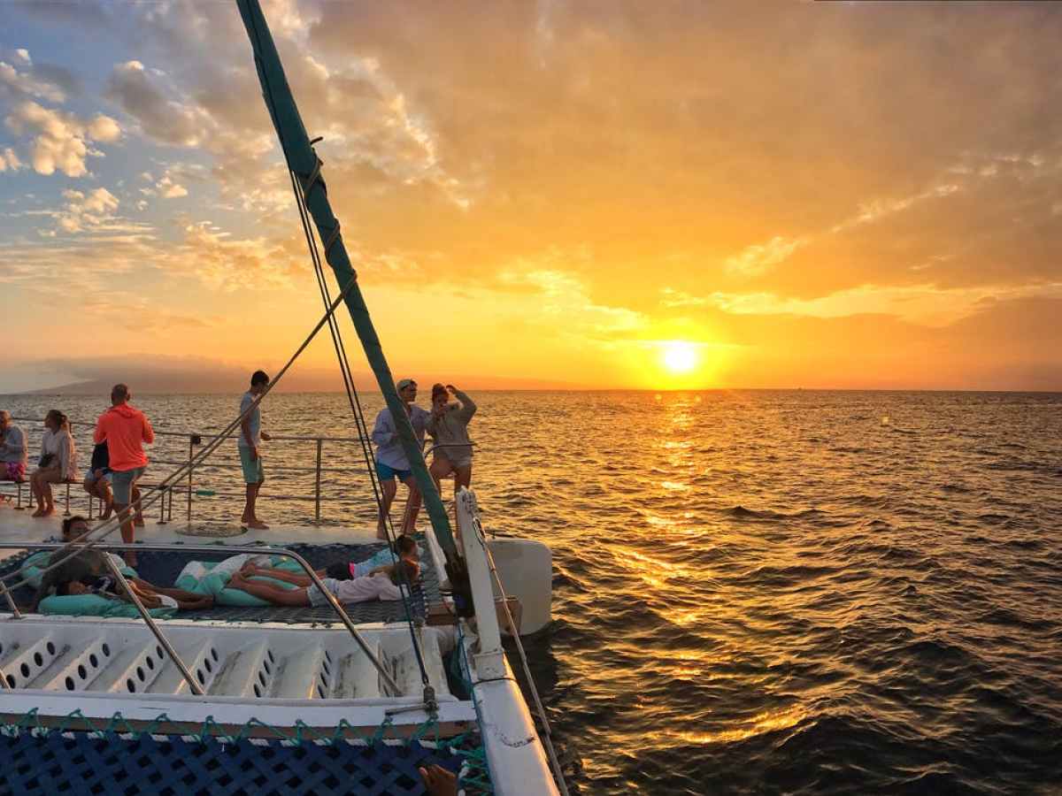 a group of people in a boat on a body of water